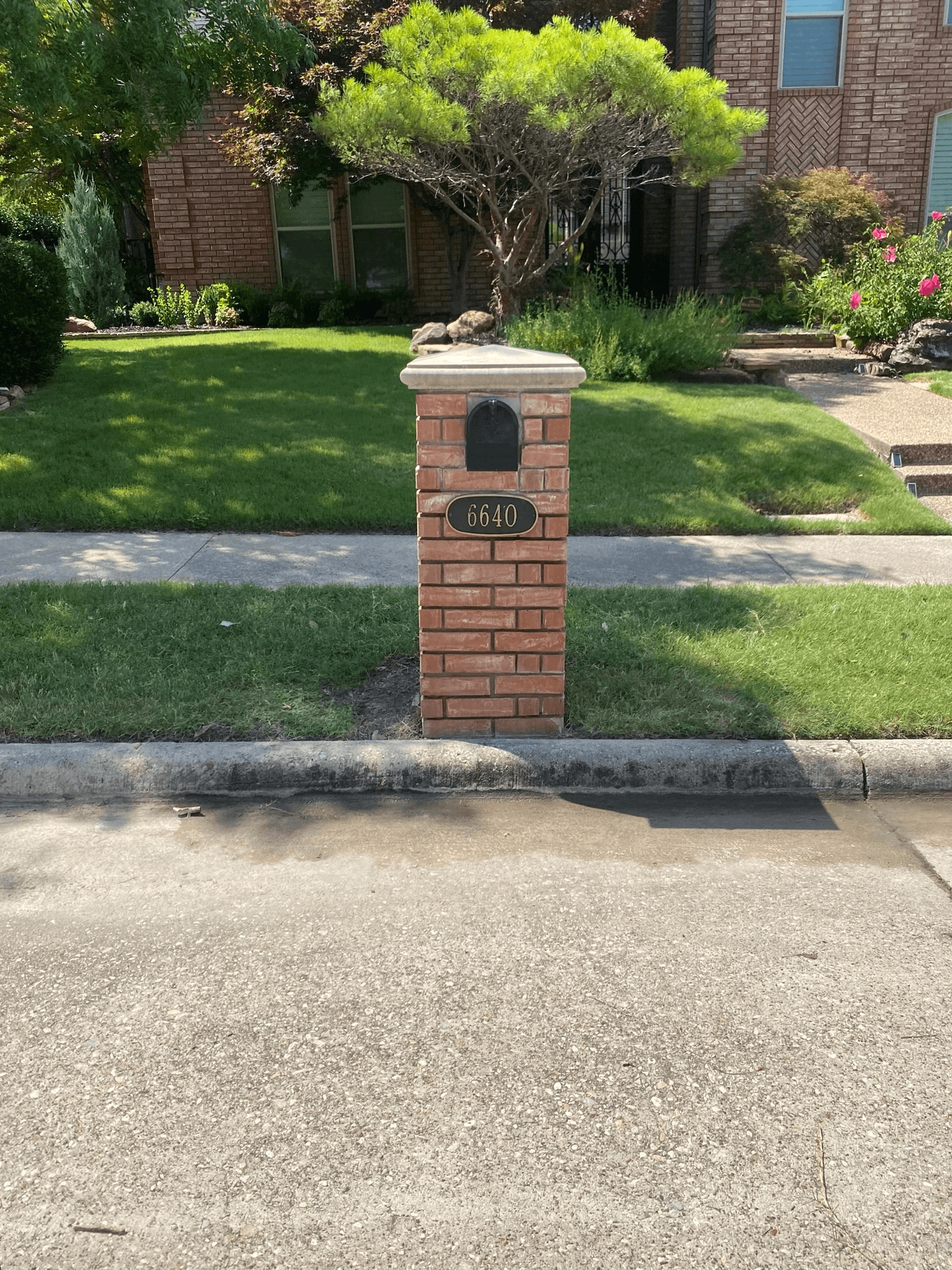 Before and after stone mailbox restoration by professional masonry contractors in McKinney, TX