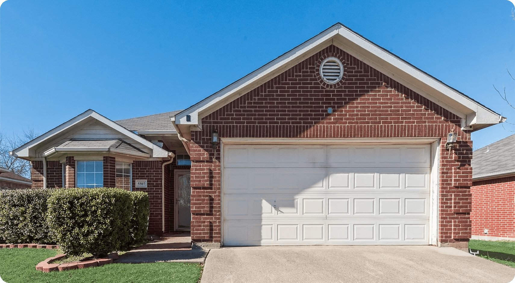 Close-up of tuckpointing work on a residential brick wall in Plano, TX by Omega Masonry